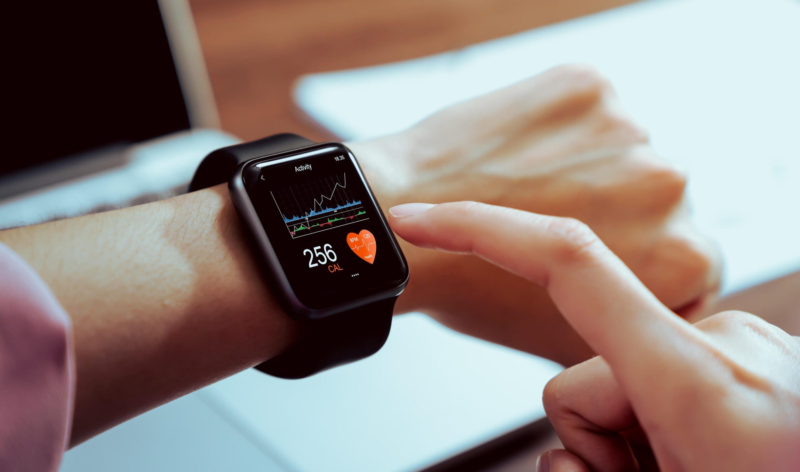 A woman checks her resting heart rate data on her Apple Watch